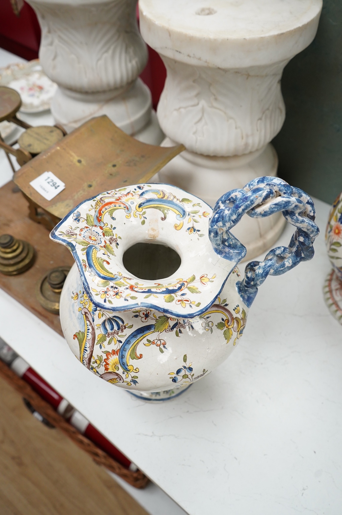 Two large French faience jugs and a vase, and a Talavera twin handled urn/vase, 44cm high